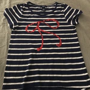 A navy blue striped tee shirt for children.